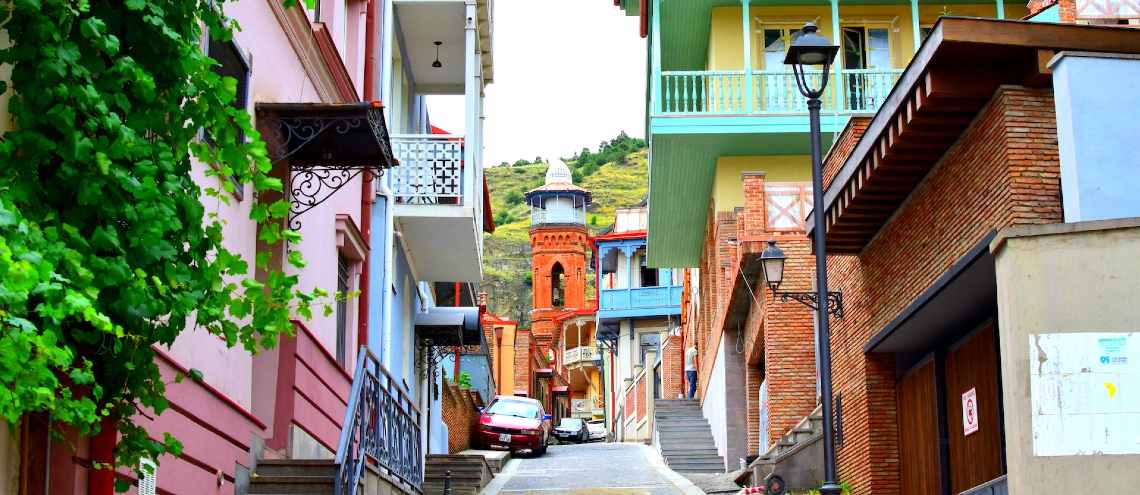 Colorful houses on a steep road in Tbilisi Georgia