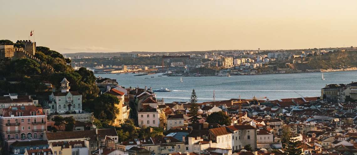 Lisbon Portugal city overview with body of water and buildings