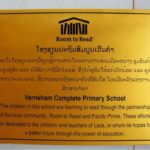 a sign that outlines the school in vientiane has been built with the support of room to read and pacific prime