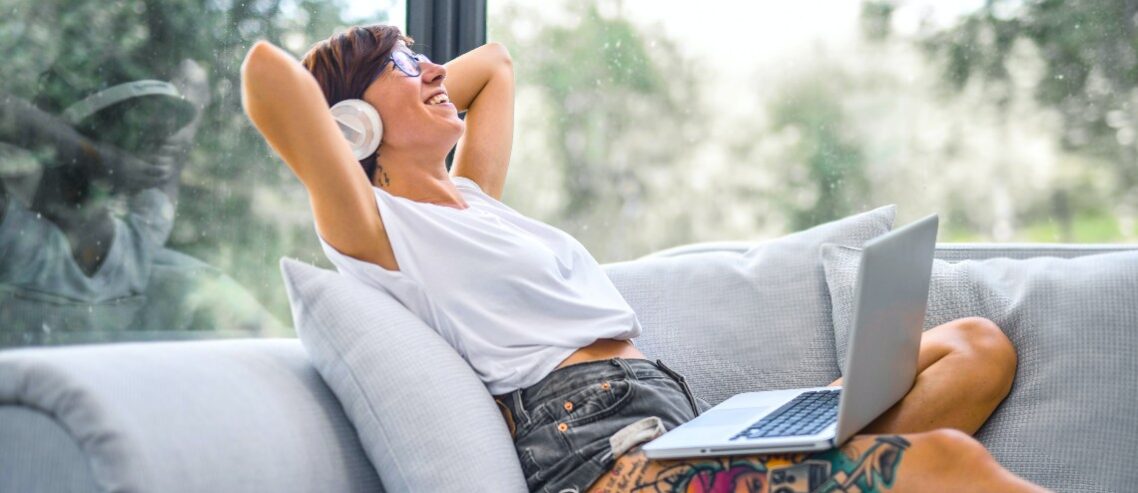 Employee relaxing on sofa at home