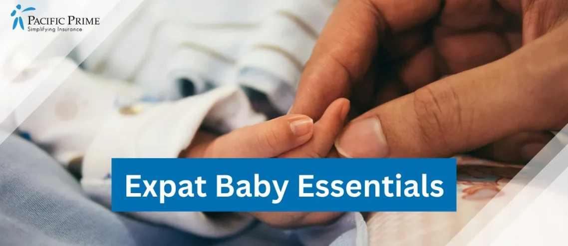 Image of an Adult Hand Gripping A Baby's Tiny Finger with text overlay of "Expat Baby Essentials"