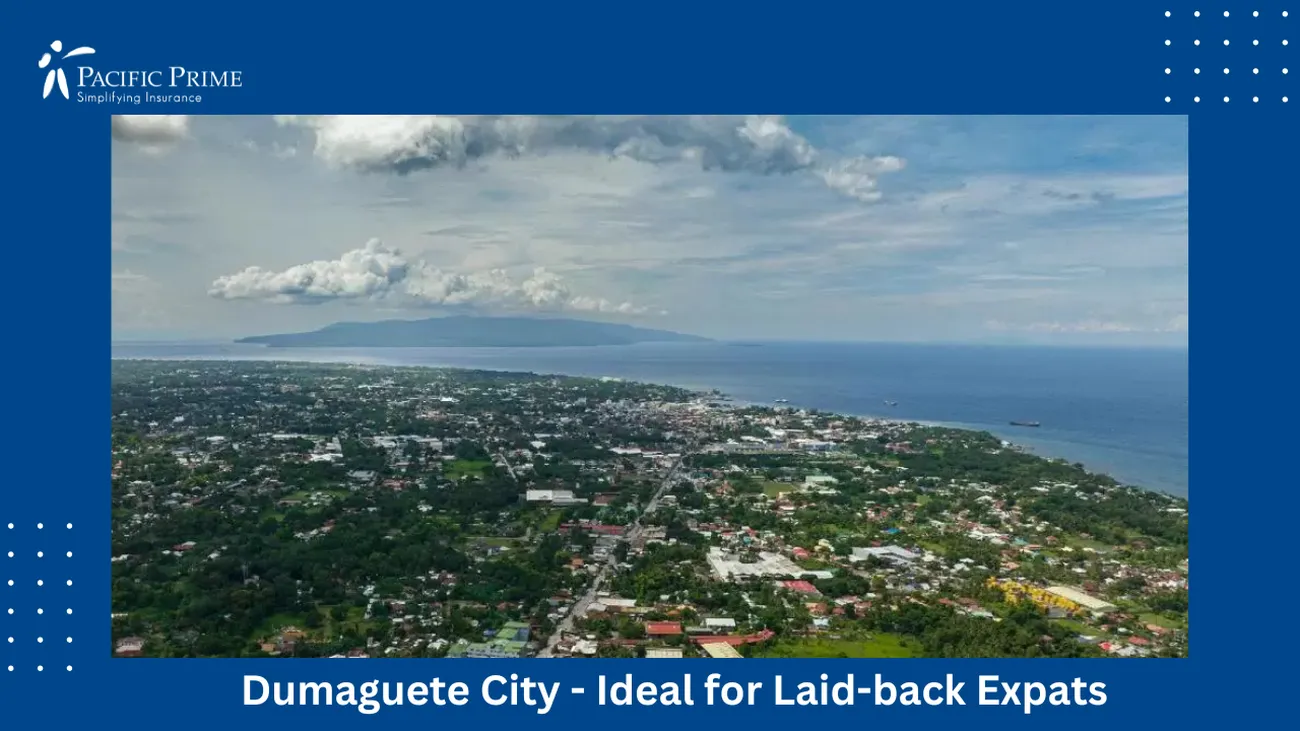 Image of Aerial View Of Dumaguete City, Philippines with text overlay of "Dumaguete City - Ideal for Laid-back Expats"