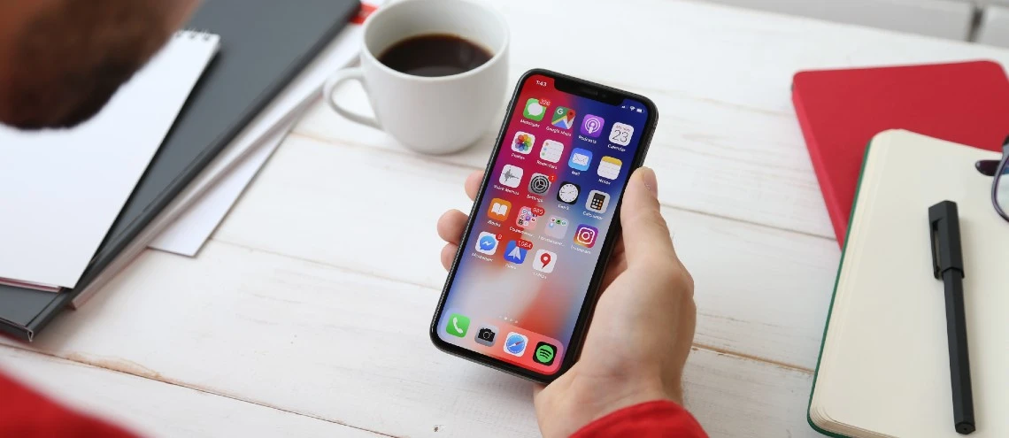 image shows a person using a smart phone