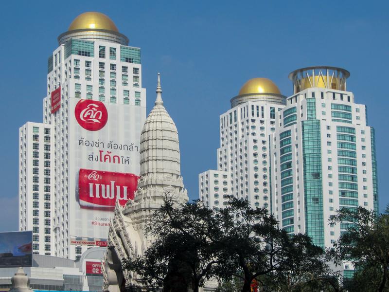 Bangkok Skyline: Towering Buildings And Temple Dome
