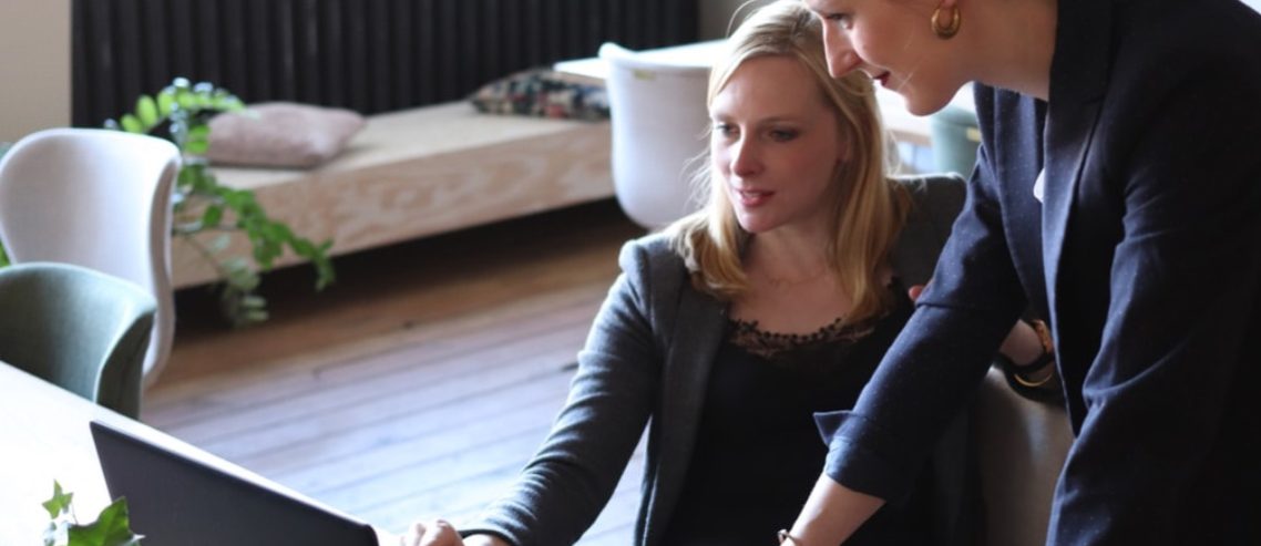 Female employee training at desk