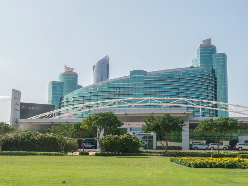 Blue skyscraper against Abu Dhabi skyline, UAE