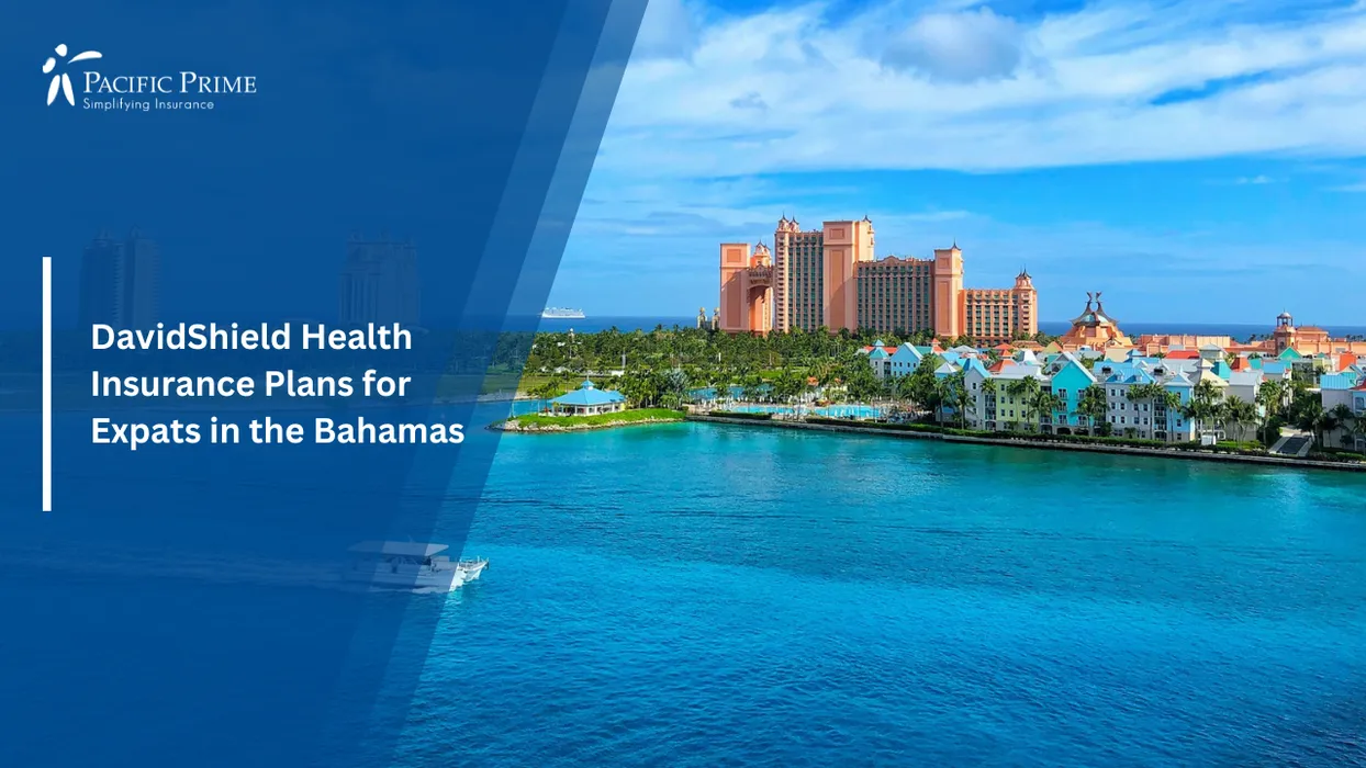 Image of Boat Gliding Past Atlantis Resort Skyline In Nassau With Sunlit Coastal Backdrop with text overlay of "DavidShield Health Insurance Plans for Expats in the Bahamas"