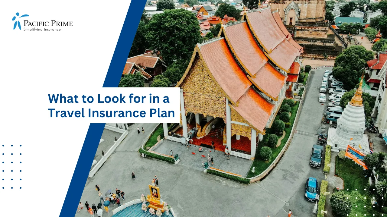 Image of Brown And White Concrete Structure In Chiang Mai, Thailand with text overlay of "What to Look for in a Travel Insurance Plan"