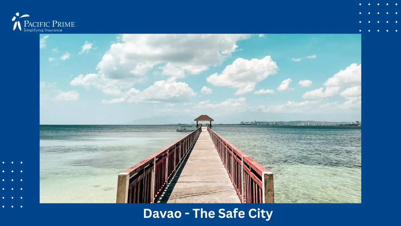 Image of Brown Wooden Dock On Sea Beneath Blue Sky In Davao City, Philippines with text overlay of "Davao - The Safe City"