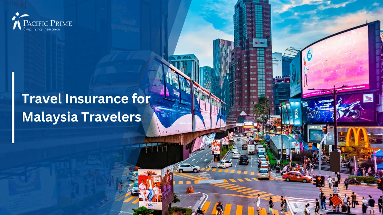 Image of Bukit Bintang Street Teeming With Traffic And Skyscrapers with text overlay of "Travel Insurance for Malaysia Travelers"