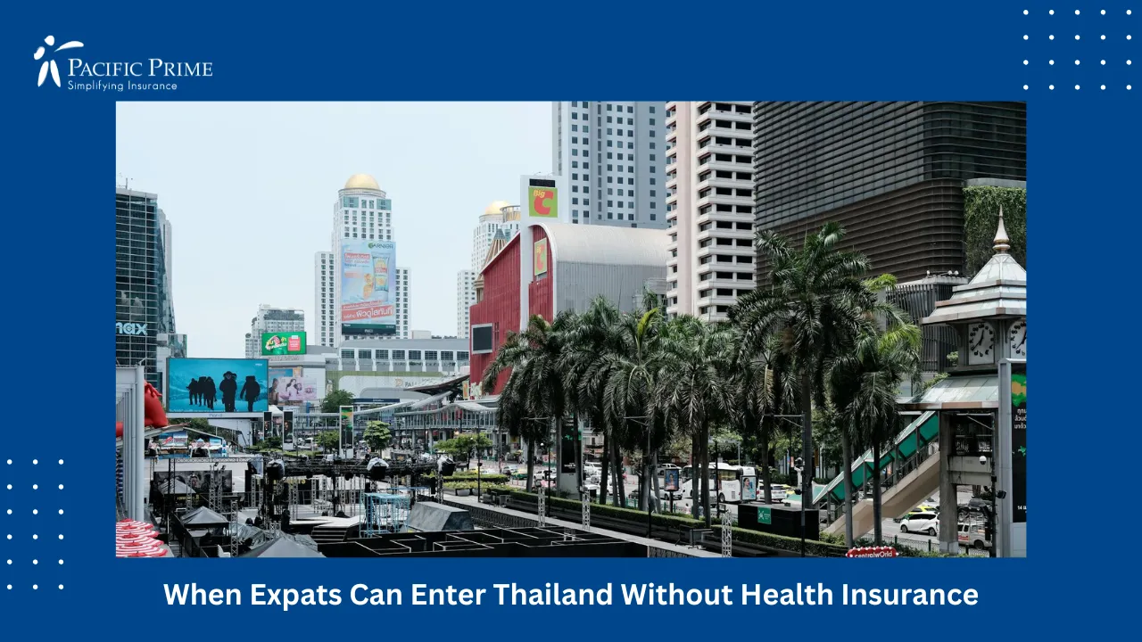 Image of Bustling Bangkok Street With Red Umbrellas, Palm Trees, And Tall Buildings with text overlay of "When Expats Can Enter Thailand Without Health Insurance"