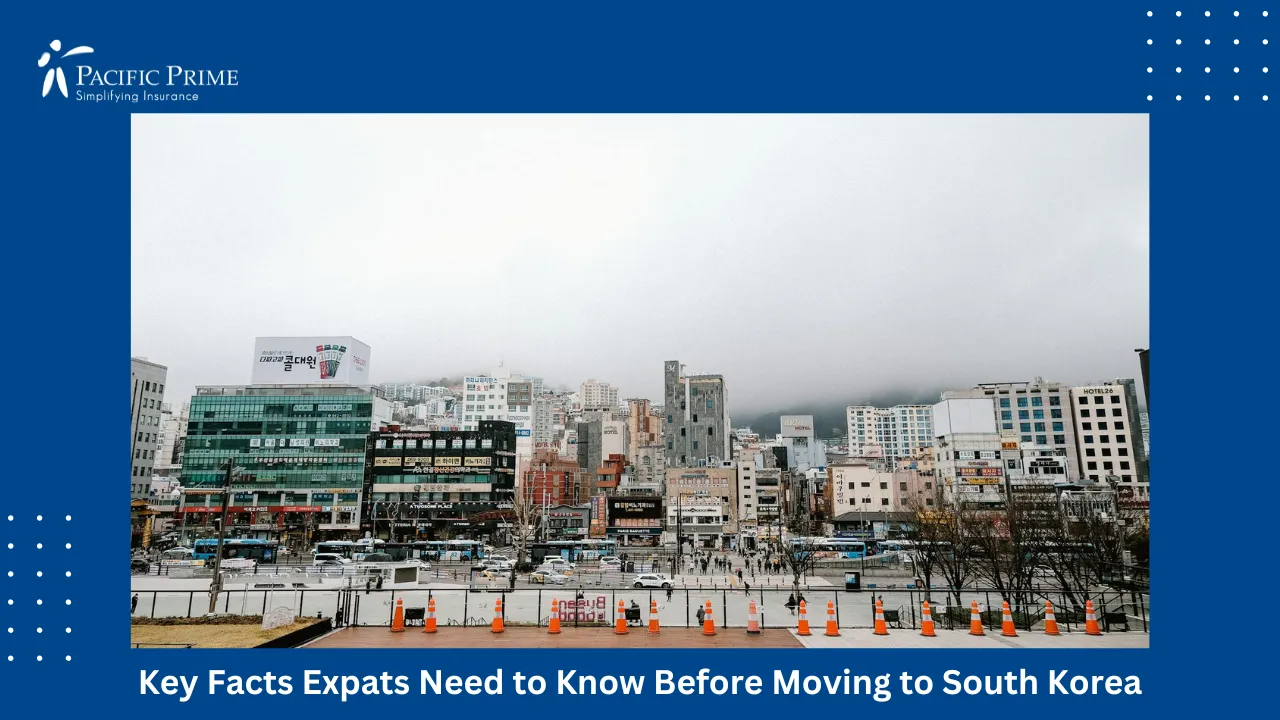 Image of Busy South Korean City Street With Traffic And Modern High-rise Buildings with text overlay of "Key Facts Expats Need to Know Before Moving to South Korea"