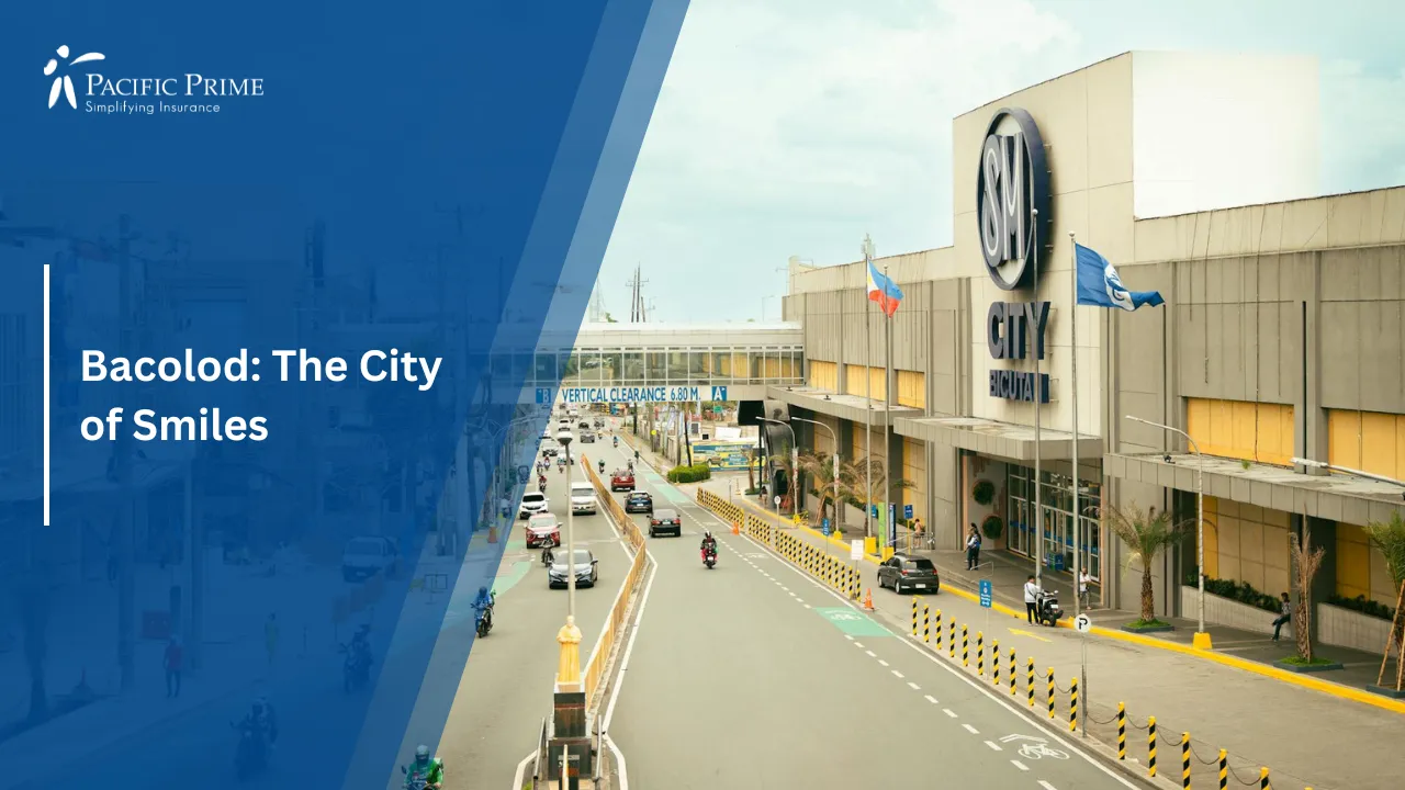 Image of Busy Street Scene In Bacolod, Philippines With Cars And Motorcycles with text overlay of "Bacolod: The City of Smiles"