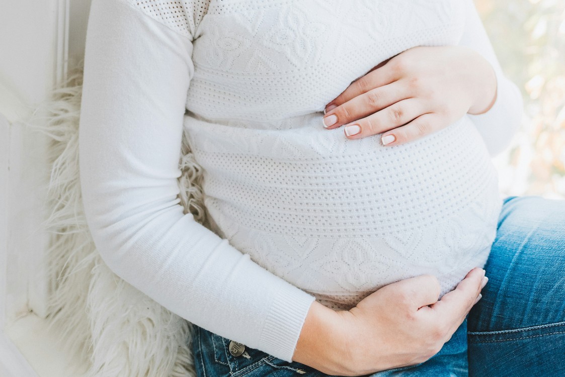 Caucasian Pregnant Woman Holding Belly