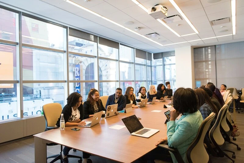 Having a team meeting in office setting