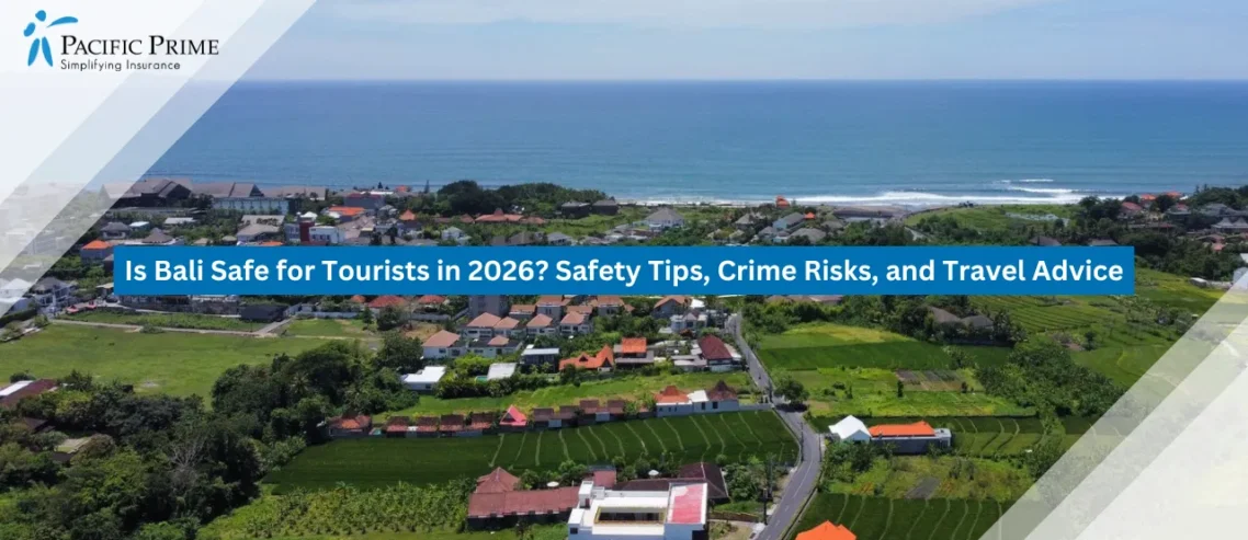 Image of Coastal Bali Village Surrounded By Tropical Greenery And Ocean Views with text overlay of "Is Bali Safe for Tourists in 2026? Safety Tips, Crime Risks, and Travel Advice"