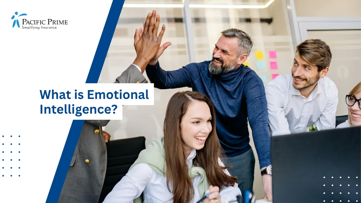 Image of Colleagues Celebrating Success With A High Five In A Collaborative Office Setting with text overlay of "What is Emotional Intelligence?"