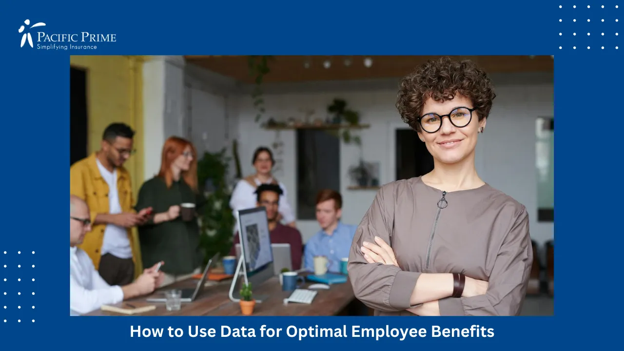 Image of Confident Businesswoman Standing In Office With Colleagues In Background with text overlay of "How to Use Data for Optimal Employee Benefits"