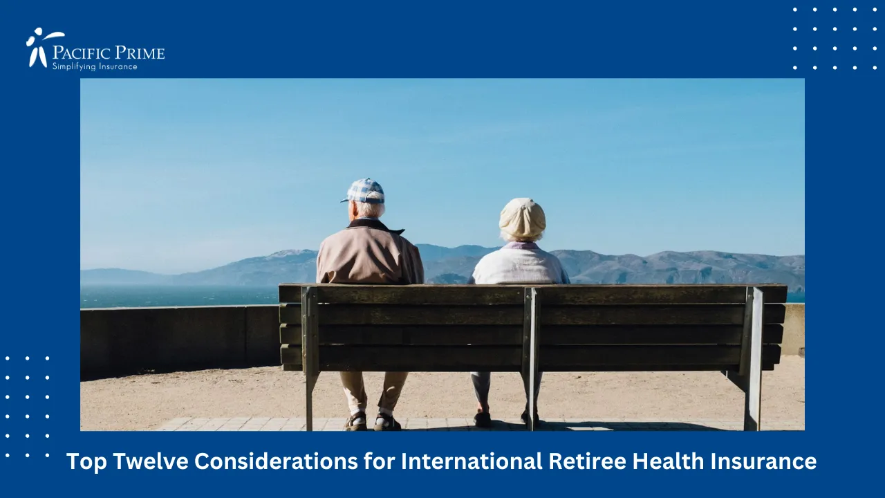 Image of Couple Sitting On Bench Facing The Ocean with text overlay of "Top Twelve Considerations for International Retiree Health Insurance"