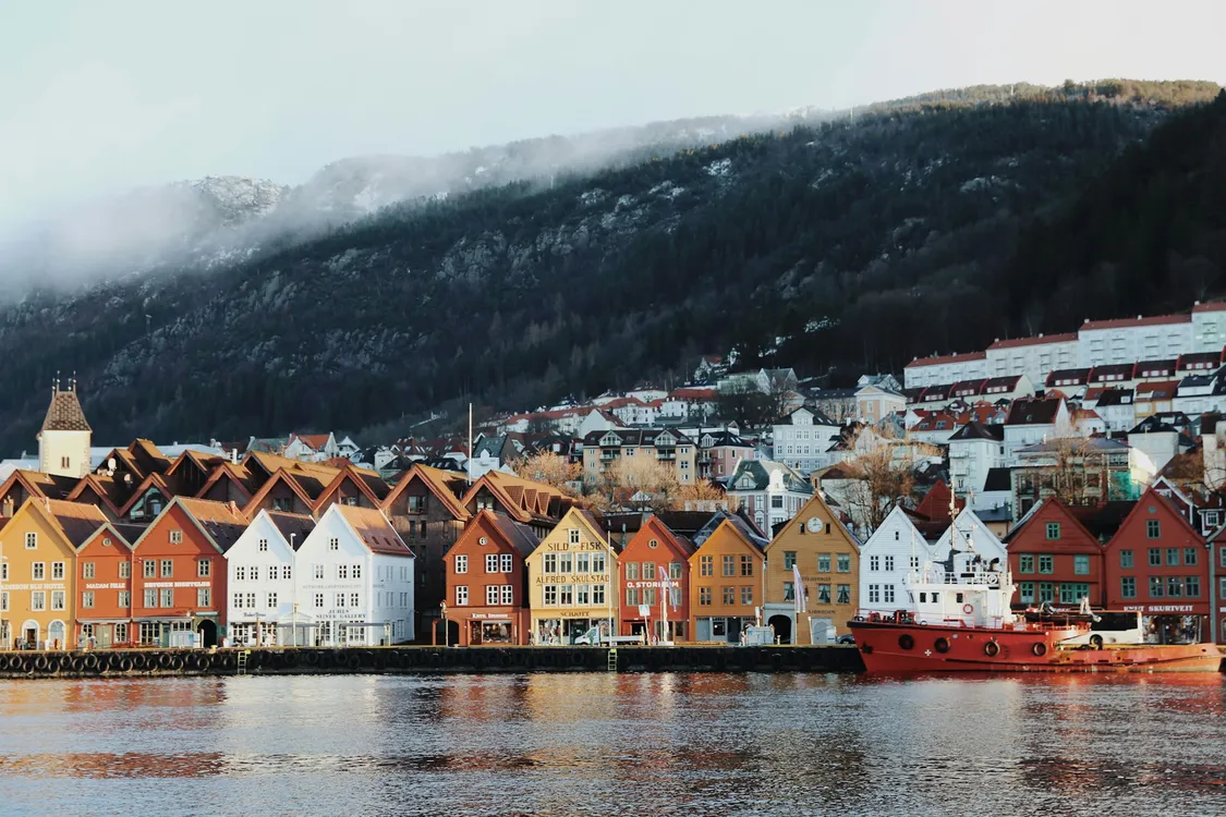Daytime View Of Houses By Water And Mountain In Bergen, Norway