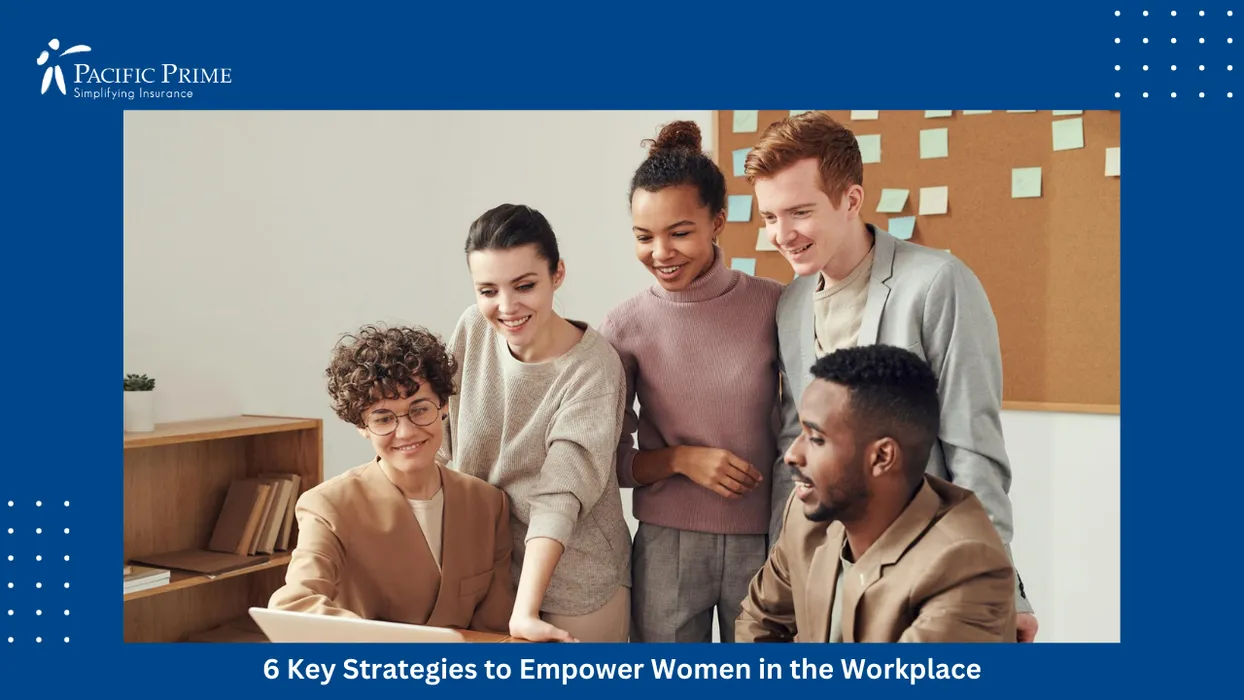 Image of Diverse Team Collaborating Over A Laptop During An Indoor Strategy Meeting with text overlay of "6 Key Strategies to Empower Women in the Workplace"