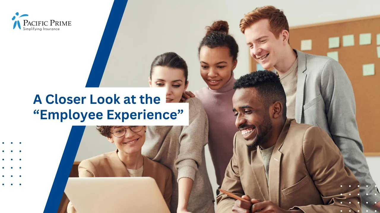 Image of Diverse Young Professionals Collaborating Around A Laptop Indoors with text overlay of "A Closer Look at the “Employee Experience”"
