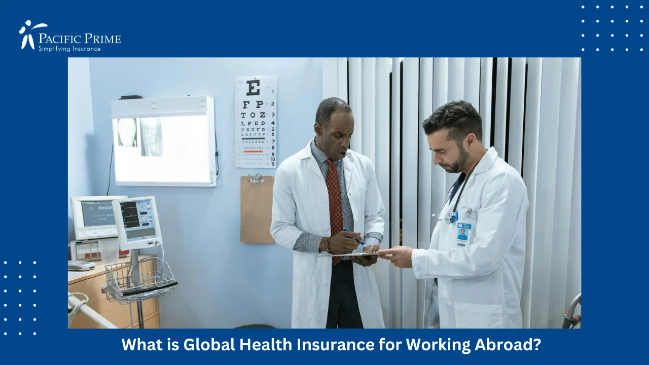 Image of Doctors Talking While Reviewing A Medical Report with text overlay of "What is Global Health Insurance for Working Abroad?"