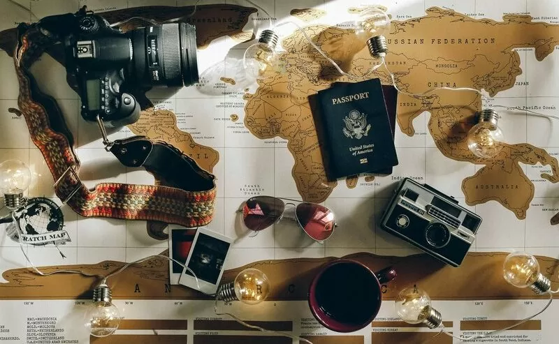 DSLR Camera and Passport, Travel Essentials