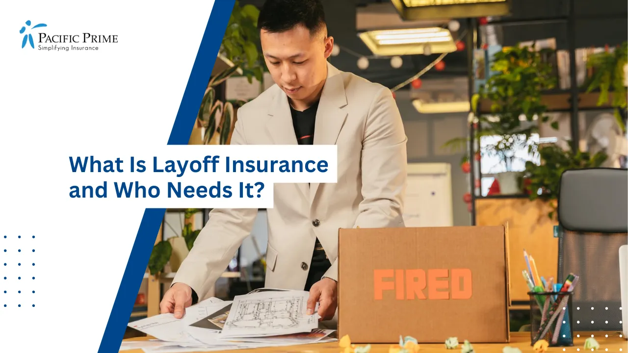 Image of Employee Packing Documents Into A Box After Job Termination In Office with text overlay of "What Is Layoff Insurance and Who Needs It?"