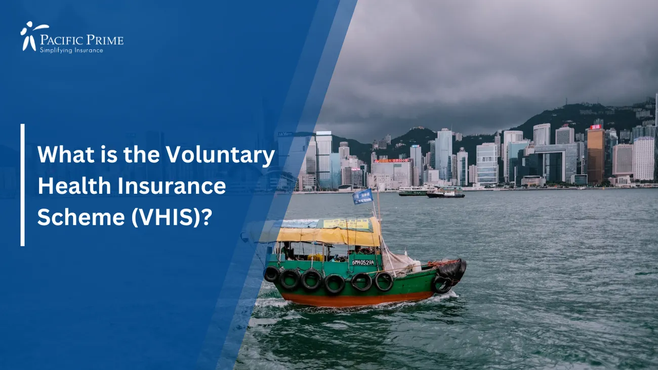 Image of Green And Red Boat On Victoria Harbour Near Hong Kong Cityscape with text overlay of "What is the Voluntary Health Insurance Scheme (VHIS)?"