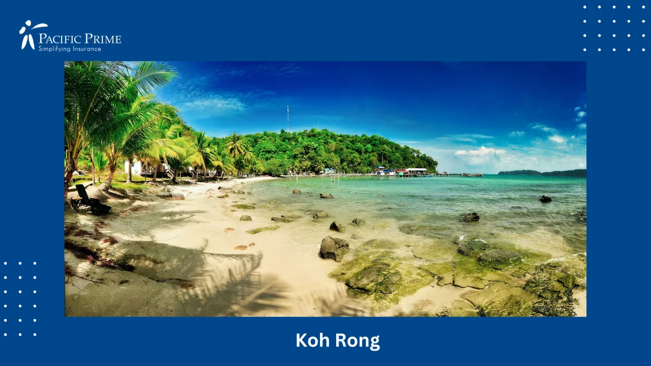 Image of Green Palm Trees Lining The Beach Shore In Koh Rong Sanloem, Cambodia with text overlay of "Koh Rong"