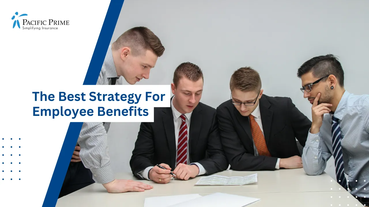 Image of Group Of Men Reviewing Documents Together At Table with text overlay of "The Best Strategy For Employee Benefits"
