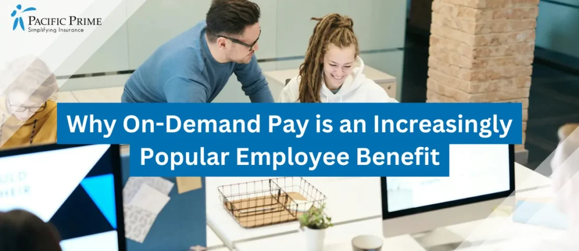 Image of Group Of People Sitting Indoors And Engaging In Discussion with text overlay of "Why On-Demand Pay is an Increasingly Popular Employee Benefit"
