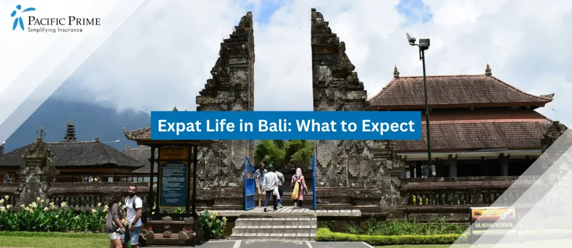 Image of Group Of People Walking Near Stone Temple In Bali with text overlay of "Expat Life in Bali: What to Expect"