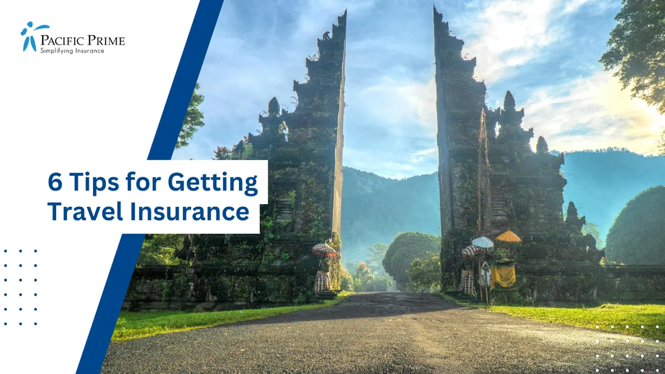 Image of Handara Gate Under A Clear Blue Sky In Buleleng, Bali with text overlay of "6 Tips for Getting Travel Insurance"
