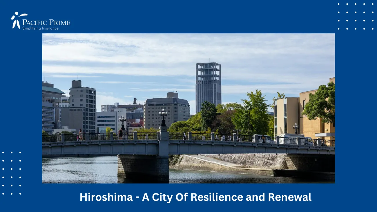 Image of Hiroshima Bridge Spanning A River With Cityscape Backdrop with text overlay of "Hiroshima - A City Of Resilience and Renewal"