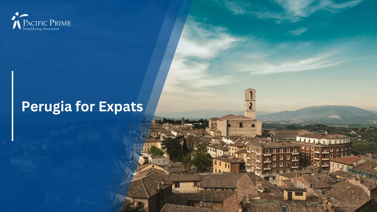 Image of Historic Brown Building Under A Clear Blue Sky In Perugia, Italy with text overlay of "Perugia for Expats"