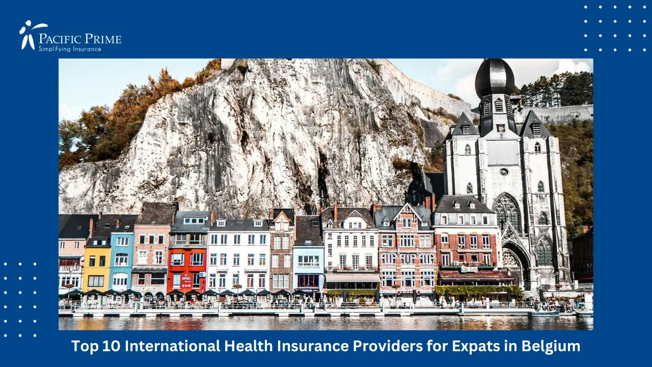 Image of Historic Riverside Building In Dinant, Belgium During Daytime with text overlay of "Top Insurance Companies in Belgium for Expats"