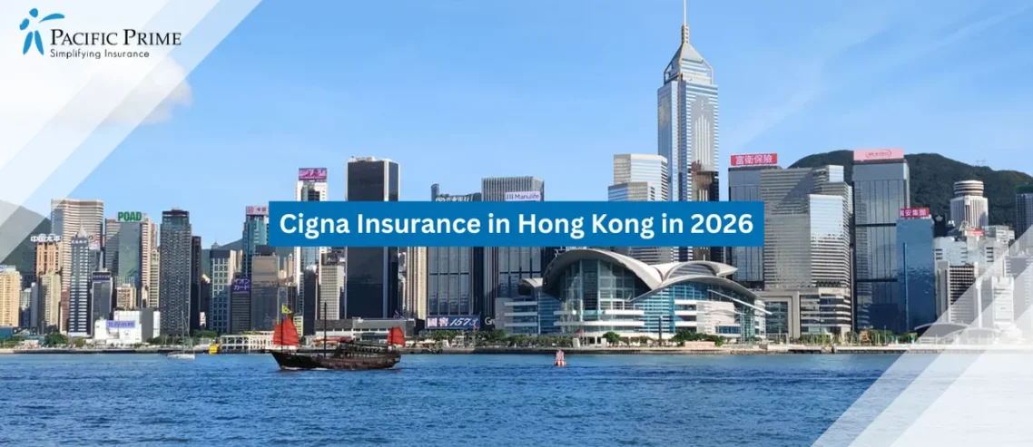 Image of Hong Kong Junk Boat Sails Across Victoria Harbour Near Wanchai Towers with text overlay of "Cigna Insurance in Hong Kong in 2026"