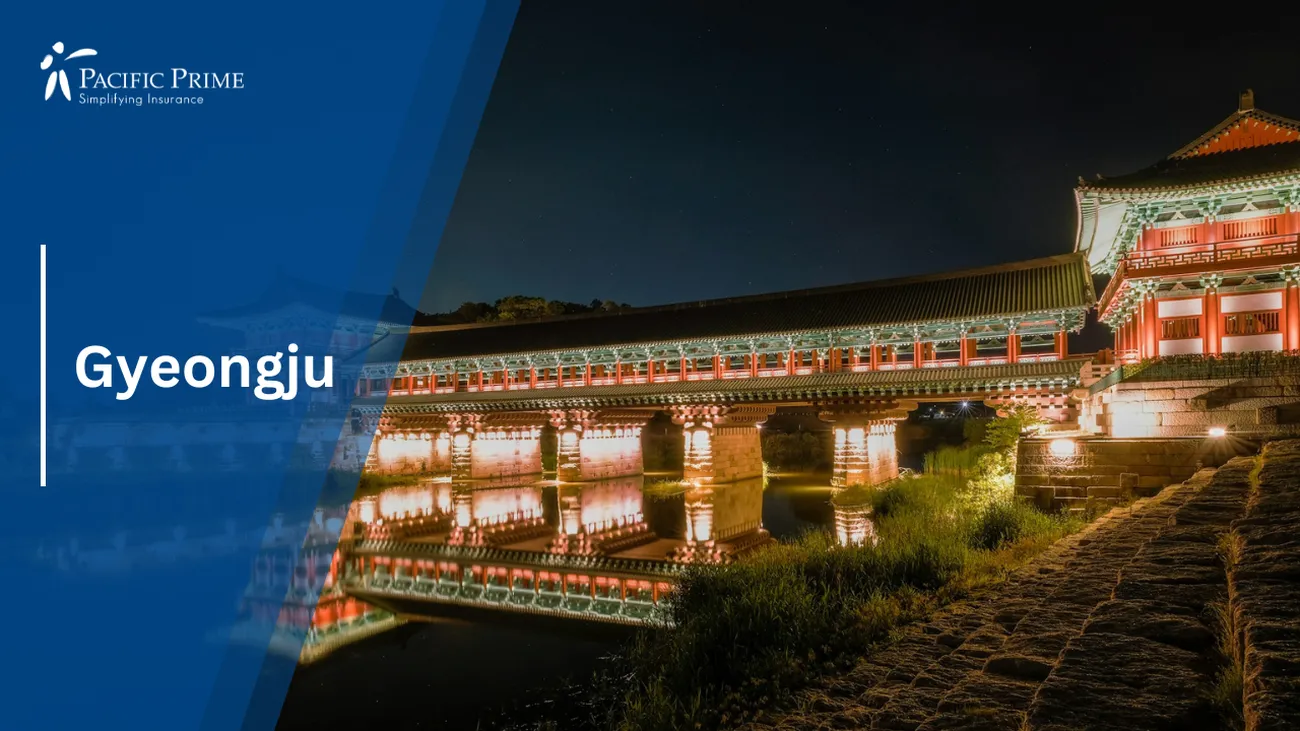 Image of Illuminated Building By Water On Iljeong-ro, Gyeongju, South Korea with text overlay of "Gyeongju"