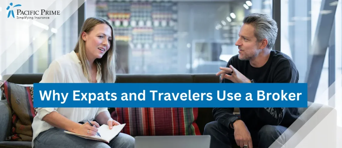 Image of Insurance Broker Explaining International Health Insurance To A Client On Red Couch with text overlay of "Why Expats and Travelers Use a Broker"