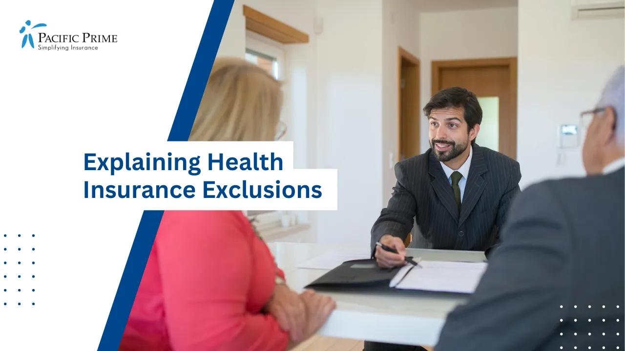 Image of Insurance Broker Explaining Policy Details To Elderly Couple with text overlay of "Explaining  Health Insurance Exclusions"