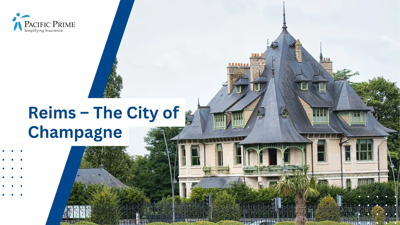 Image of Large White House With Black Roof In Reims, France with text overlay of "Reims – The City of Champagne"