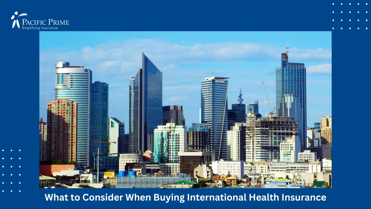 Image of Makati Skyline With Tall Skyscrapers Under Clear Blue Sky, Philippines with text overlay of "What to Consider When Buying International Health Insurance"