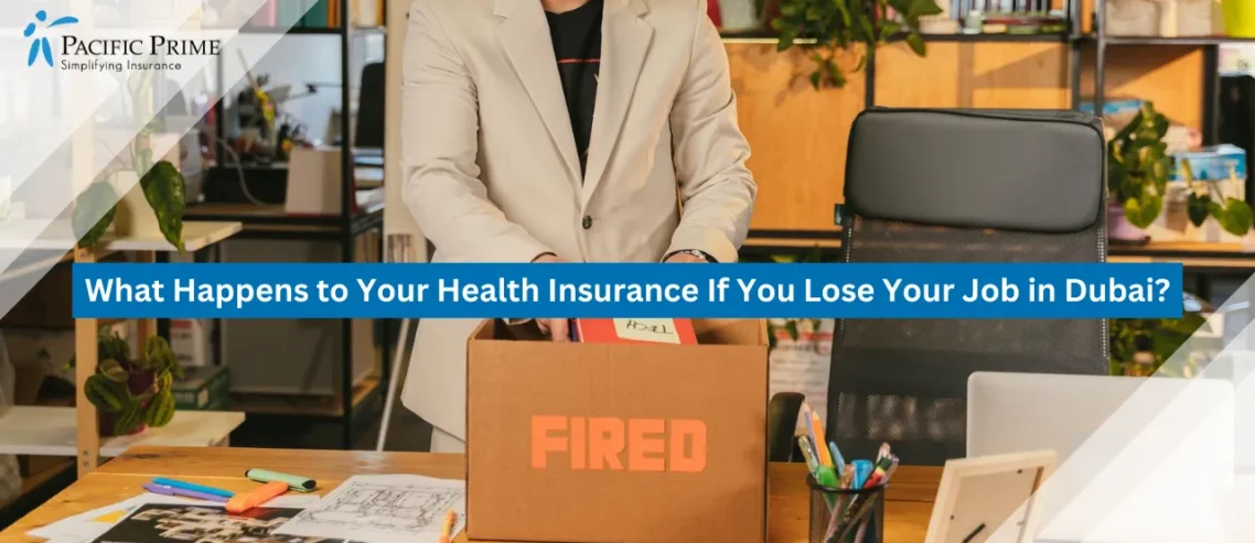 Image of a Man Packing Belongings At Office Desk After Losing Job with text overlay of "What Happens to Your Health Insurance If You Lose Your Job in Dubai?"