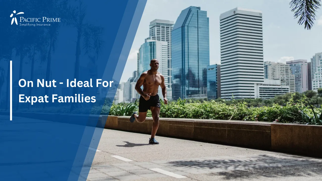 Image of Man Running Shirtless On A Walkway With A Bustling City View In Bangkok with text overlay of "On Nut - Ideal For Expat Families"