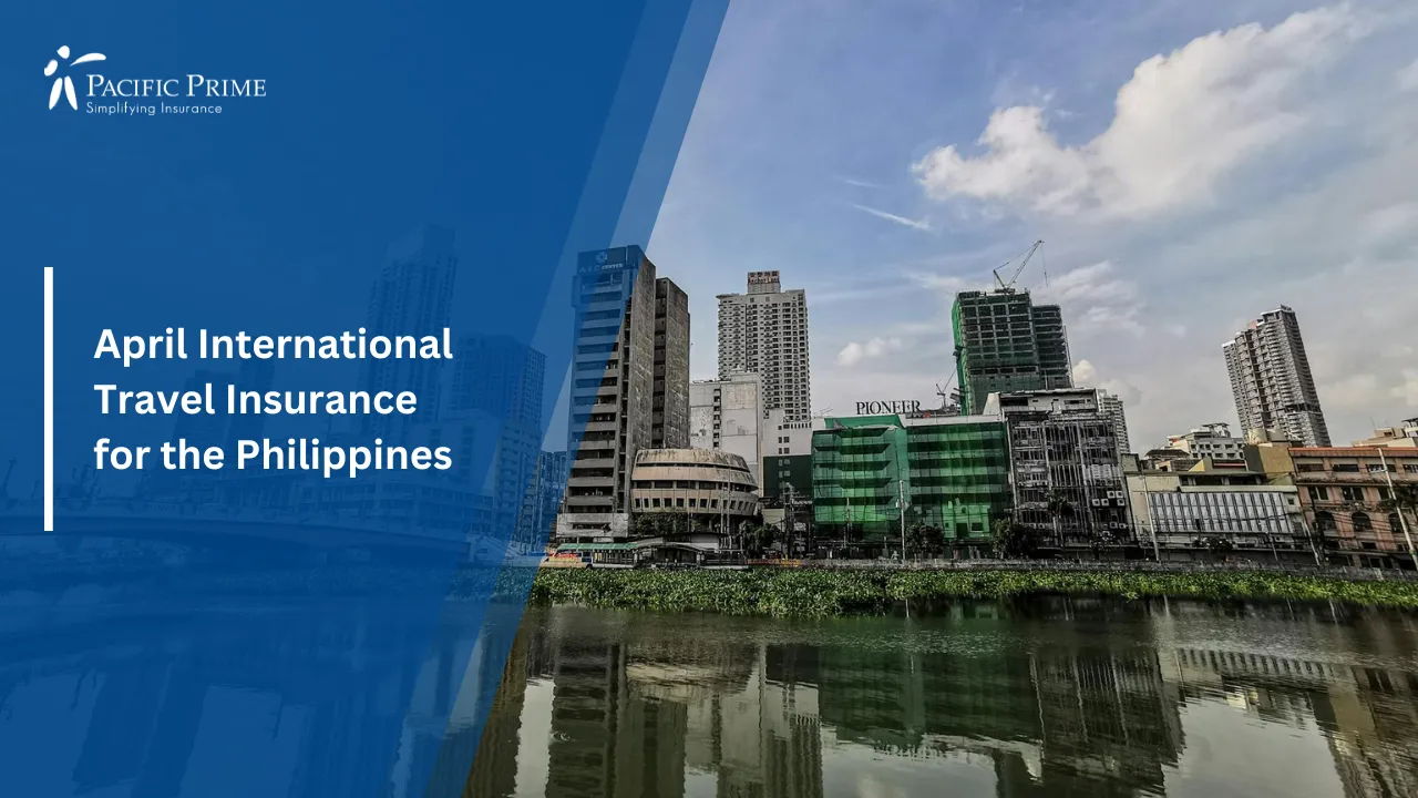 Image of Manila Skyline With Modern High-rise Buildings Along A River Bay with text overlay of "April International Travel Insurance for the Philippines"