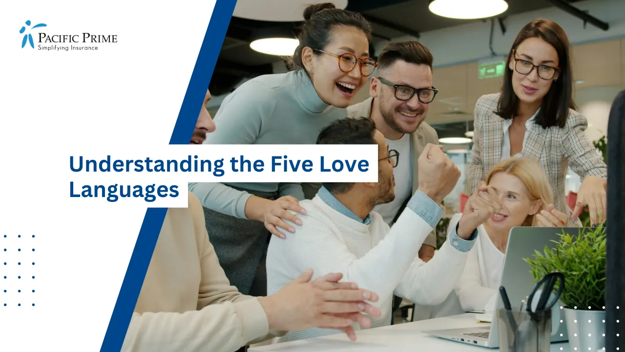 Image of Multicultural Coworkers High-fiving To Celebrate Success In An Open Office with text overlay of "Understanding the Five Love Languages"