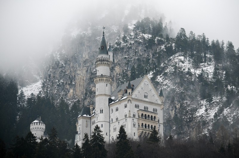 Neuschwanstein Castle, Germany: Snowy Mountain Backdrop