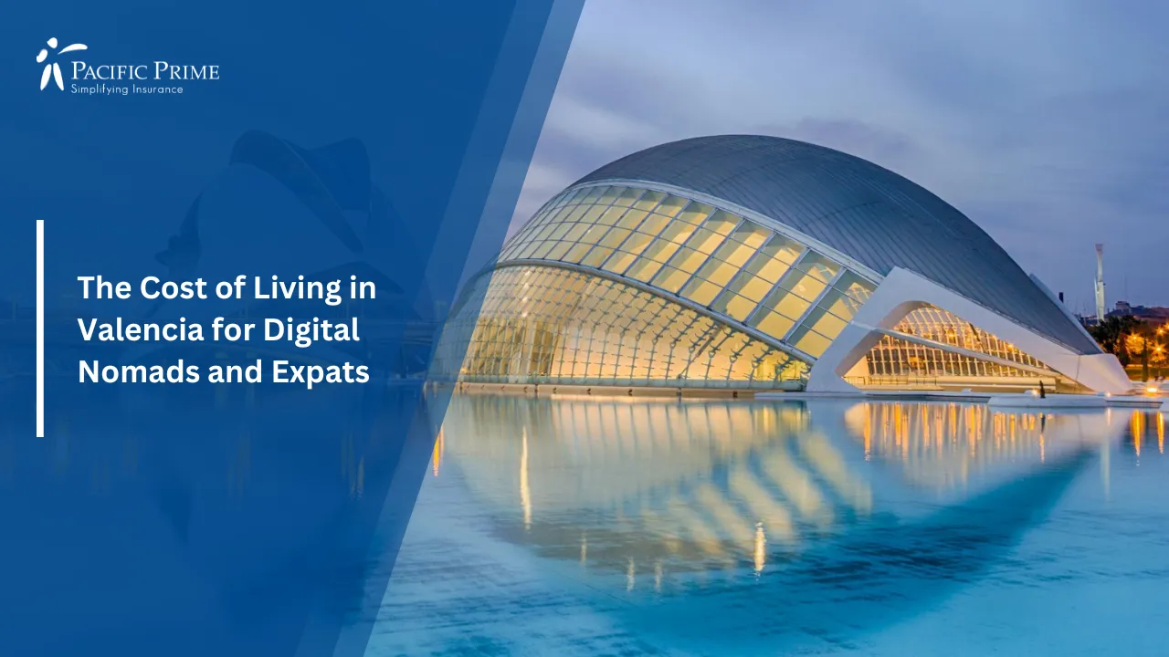 Image of Night Cityscape Of Valencia Reflected In The Sea with text overlay of "The Cost of Living in Valencia for Digital Nomads and Expats"